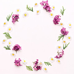 Wreath with daisy and violet lilac flowers