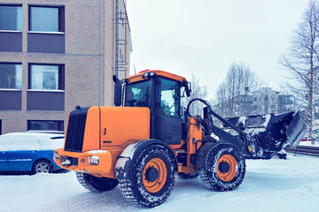 Snow removal tractor in winter Rovaniemi