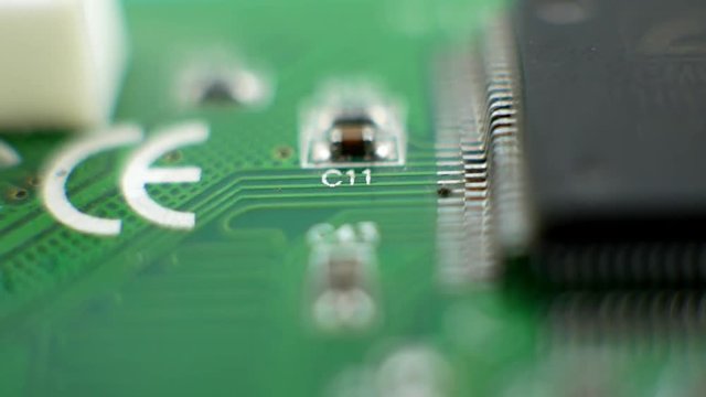 Electronic green circuit board with resistor, capacitors and processor