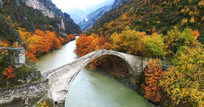 Aerial view of Konitsa stone bridge and Aoos River an autumn day, Greece. National park