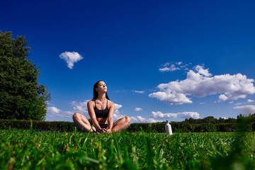 Girl sitting in the Park and enjoy the sunlight.