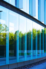 Windows of modern futuristic steel and glass skyscraper building