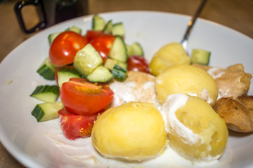 Closeup Potatoes Delicious Meal Tomatoes Cucumber Chicken Breast White Bowl Spoon Cup Water Greek Yogurt