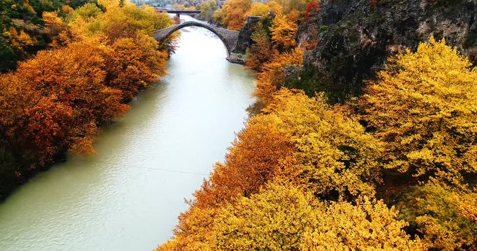 Aerial view of Konitsa stone bridge and Aoos River an autumn day, Greece. National park