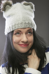 Close up portrait of young woman wearing funny hat 