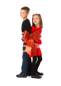 Christmas: Boy And Girl Tied Up With Ribbon