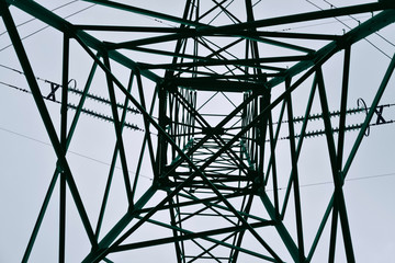 Electricity pylon to support the overhead power line captured from below