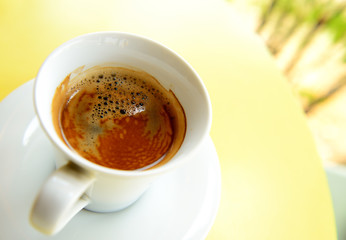 Cup of coffee on table in the morning