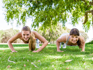 Young women exercising in the park