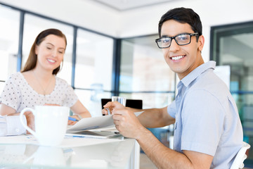 Obraz premium Image of two young business people in office