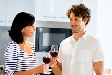 Portrait of a couple having a glass of red wine