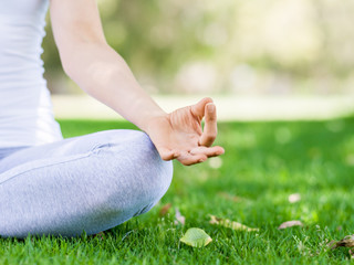 Woman meditating in the park