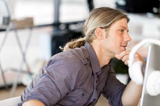 Happy young man designer working