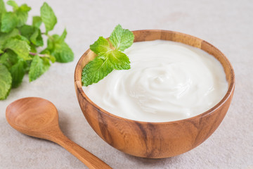Yogurt in wooden bowl