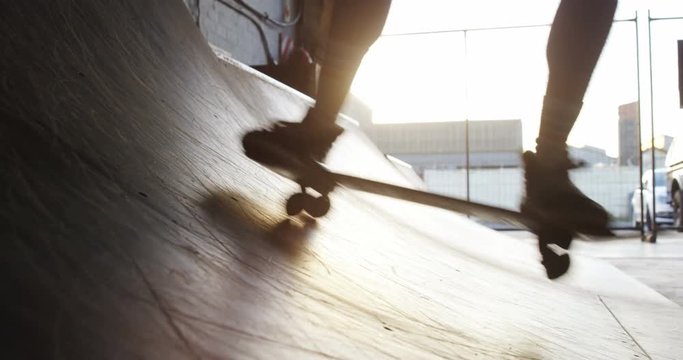 Man practicing skateboarding in skateboard arena 