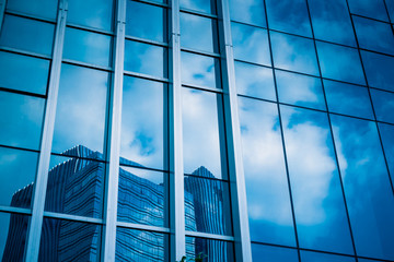 Clouds Reflected in Windows of Modern Office Building..