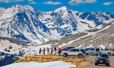 Visitors observe the peaks from Trail Ridge Road in Rocky Mountain National Park, Colorado