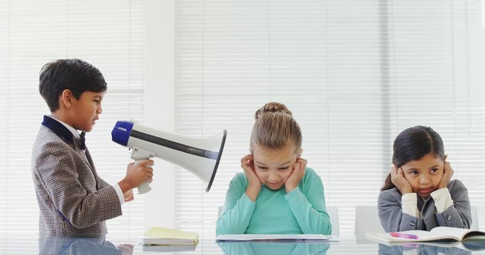 Kids as businessman shouting through loudspeaker at his coworkers 