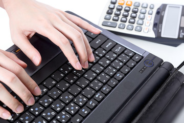 Hands typing on the keyboard