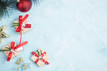 Flat lay top view christmas gifts with toys on blue table. Nea year concept. Text space