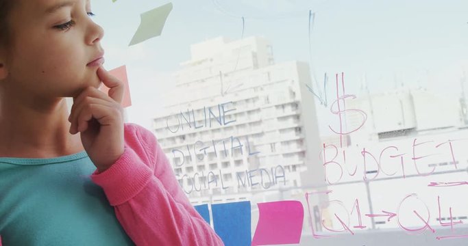 Thoughtful girl as executive looking at the sticky notes  