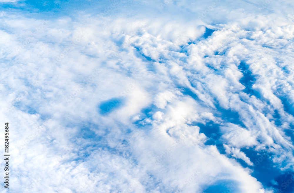 Wall mural blue sky and cloud (cirrocumulus)top view from airplane window,nature background..
