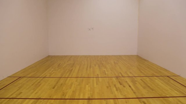 Racket ball bouncing agains the wall.