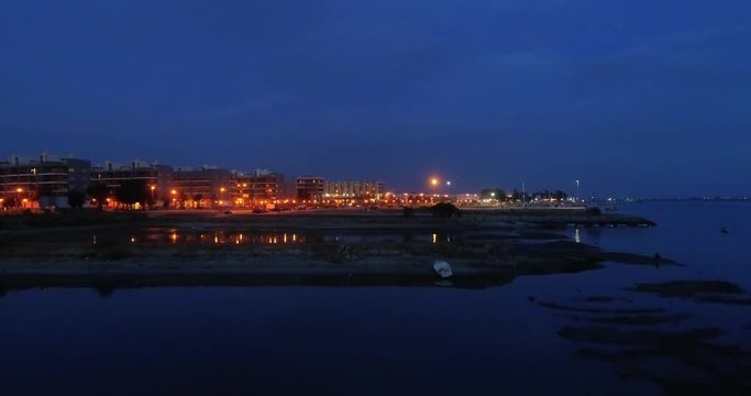 Dusk aerial seascape view of Olhao salt marsh Inlet, waterfront to Ria Formosa natural park. Algarve.