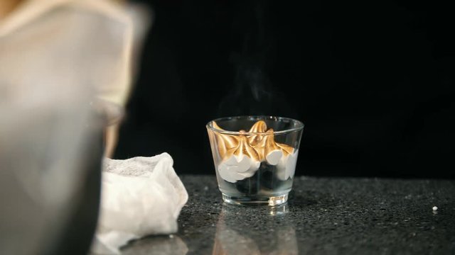 Process cooking of meringue - chef use fire for decorates dessert