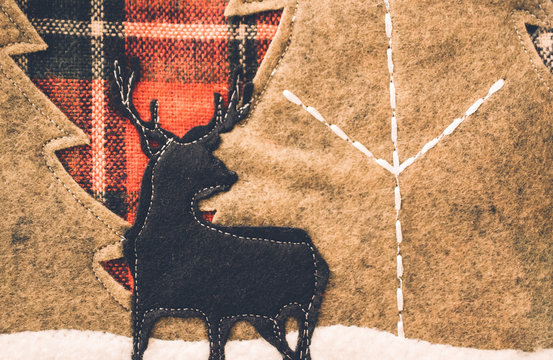 Stitched fabric reindeer Christmas background