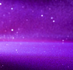 Purple glitter lights christmas bokeh background. defocused