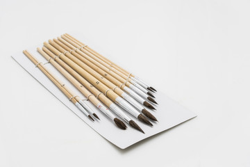 Set of Old and Used Paint Brushs in different sizes, on white background