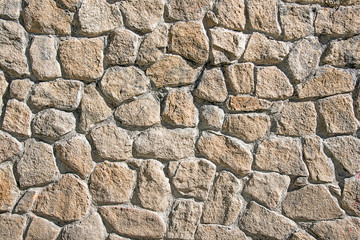 Background from a rough wall made of natural stone
