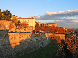 Bergamo, old city. Italy. Fiery sunset from the Venetian walls