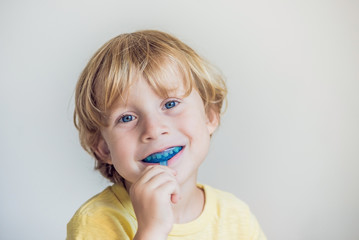 Three-year old boy shows myofunctional trainer to illuminate mouth breathing habit. Helps equalize...
