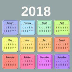 2018 Calendar year. Week starts Sunday. Vector graphic. Colorful design stationery template. Yearly calendar organizer on gray background. 