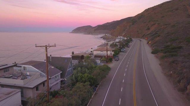 rosy dawn flying north over PCH in Malibu