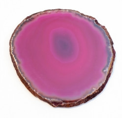 Vibrant and shiny agate rock slice isolated on white background
