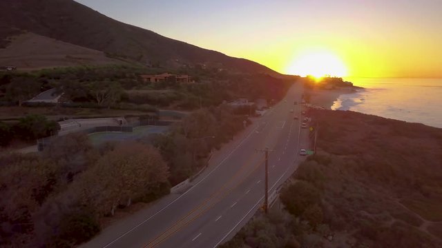 dawn flying left over PCH in Malibu