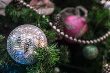 New Year's spheres on a fir-tree close up