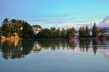 Fototapeta premium Lake, reflection of the sunset sky, palm trees, Koh Samui, Thailand