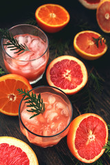 Cocktail with slices of grapefruit on a turquoise background. Grapefruit Martini