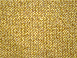 Texture of yellow knitted fabric