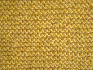 Texture of yellow knitted fabric