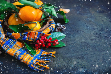 Christmas and New Year's composition with fresh tangerines, Happy New Year and Merry Christmas. Selective focus.