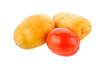 Potatoes and tomatoes isolated on white background.