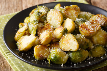 Delicious homemade fried brussels sprouts with Parmesan close-up. horizontal