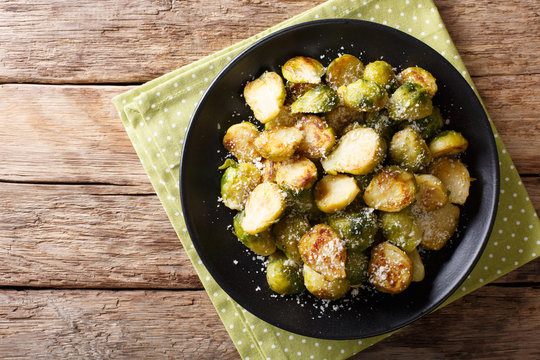 Vegetarian Food: Fried Brussels Sprouts With Garlic And Parmesan Cheese Close-up. Horizontal Top View