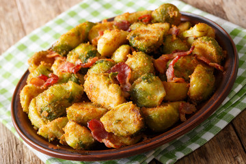 fried in breaded Brussels sprouts with bacon close-up. horizontal, rustic