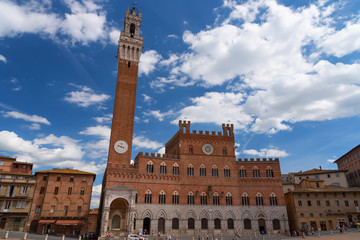 Fototapeta na wymiar Campo Square (Piazza del Campo), Palazzo Pubblico and Mangia Tower (Torre del Mangia), Siena, Italy. The historic centre of Siena has been declared by UNESCO a World Heritage Site.